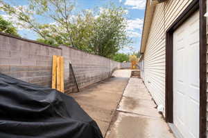 View of side of home with a fenced backyard