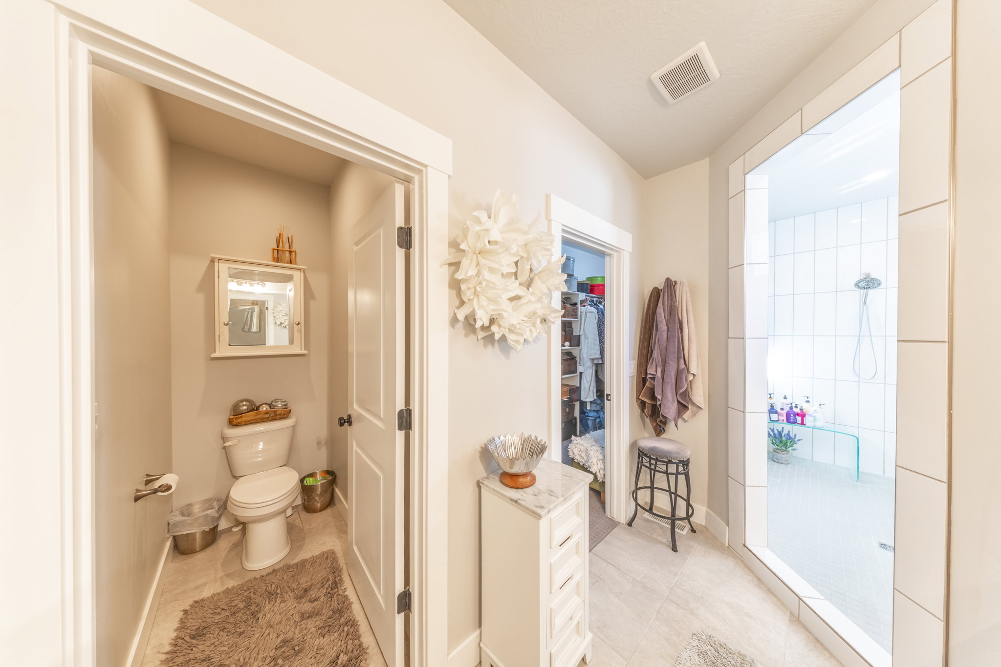 Bathroom featuring walk in shower and light tile patterned floors