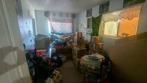 Miscellaneous room featuring a textured ceiling