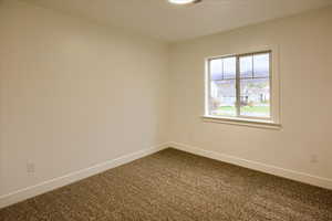 Bedroom #2 with carpet and baseboards