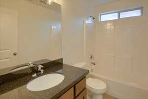 Full bathroom featuring shower / tub combination and vanity
