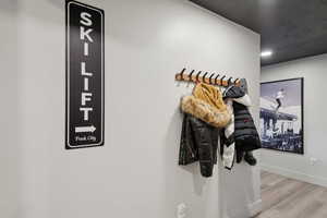 Detailed view of wood finished floors and recessed lighting