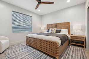 Bedroom with wood finished floors, recessed lighting, and ceiling fan