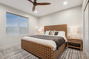 Bedroom featuring ceiling fan, a closet, and recessed lighting