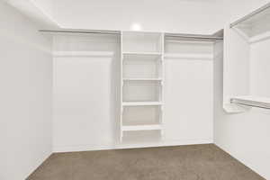 Walk-in-closet located in primary bedroom