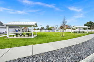 Community featuring a picnic area and pickleball court