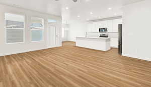 Empty living room / kitchen area