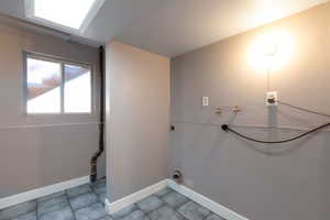 Laundry area featuring hookup for a washing machine and hookup for an electric dryer