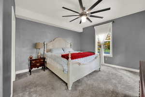 Bedroom with carpet and a ceiling fan