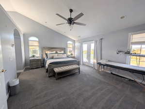 Bedroom featuring access to outside, french doors, dark carpet, ceiling fan, and arched walkways