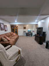 Living area featuring carpet and recessed lighting