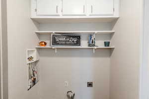Laundry area featuring washer hookup and electric dryer hookup