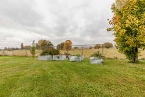 View of yard featuring a vegetable garden and a view of countryside