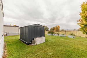 View of shed with a garden