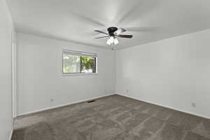 Bedroom with carpet flooring and ceiling fan