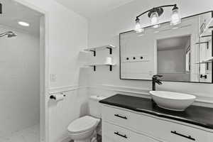 Primary bathroom with walk in shower and vanity