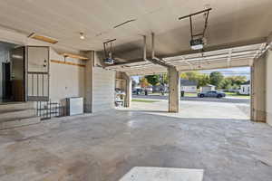 Garage featuring a garage door opener