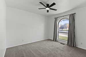Bedroom with carpet flooring and ceiling fan