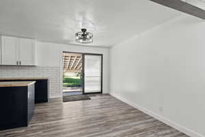 Dining area with LVP flooring and sliding glass door