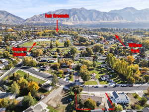 Aerial perspective of suburban area with a mountain backdrop