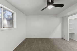Bedroom with carpet flooring and ceiling fan