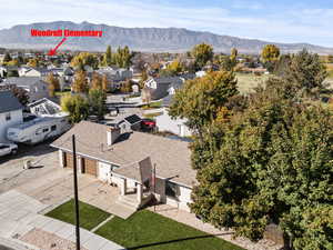 Aerial view of residential area featuring a mountain backdrop