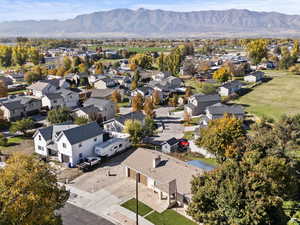 Aerial perspective of suburban area with a mountainous background