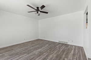 Living room with LVP flooring and ceiling fan
