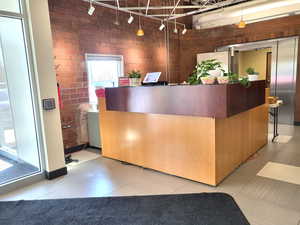 Reception featuring brick wall