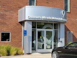 Property entrance with french doors and brick siding