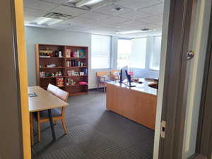 Office featuring a drop ceiling
