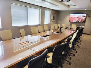 Office with plenty of natural light and recessed lighting