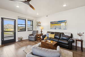 Living area with hardwood / wood-style flooring, ceiling fan, recessed lighting, and a mountain view