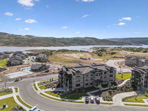Aerial perspective of suburban area featuring a water and mountain view