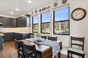 Dining area featuring light wood-style floors and recessed lighting