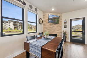Dining area featuring wood finished floors and baseboards