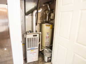 Utilities featuring water heater and heating unit