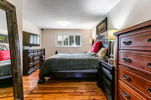 Bedroom with light wood-style floors