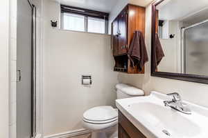 Full bath with vanity and a shower stall