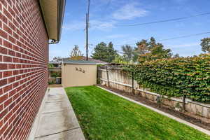 Fenced backyard with a shed