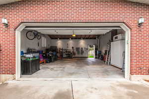 Huge garage with workbench and storage above