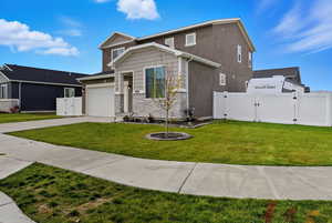 Craftsman house with a gate, stone siding, a garage, concrete driveway, and stucco siding