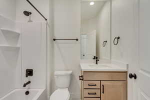 Full bathroom with shower / tub combination and vanity