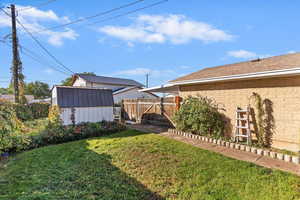 Fenced backyard with a shed