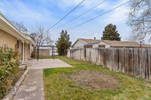 Fenced backyard featuring a patio area