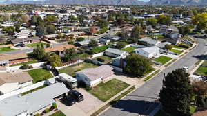 Aerial perspective of suburban area with a mountainous background