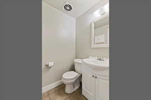Bathroom with vanity and light tile patterned floors