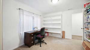 Office with light colored carpet