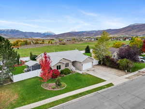View of mountain background featuring rural landscape
