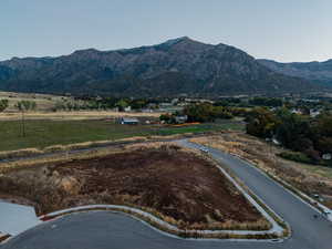 View of mountain backdrop featuring rural landscape